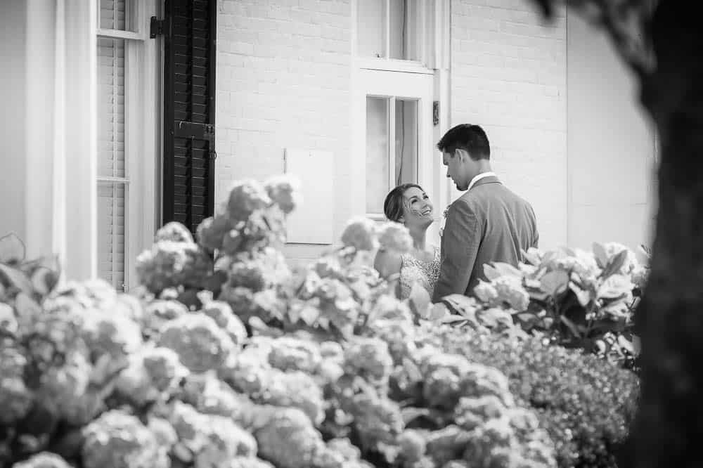 Black and white image of Couples First look outside Congress Hall wedding venue