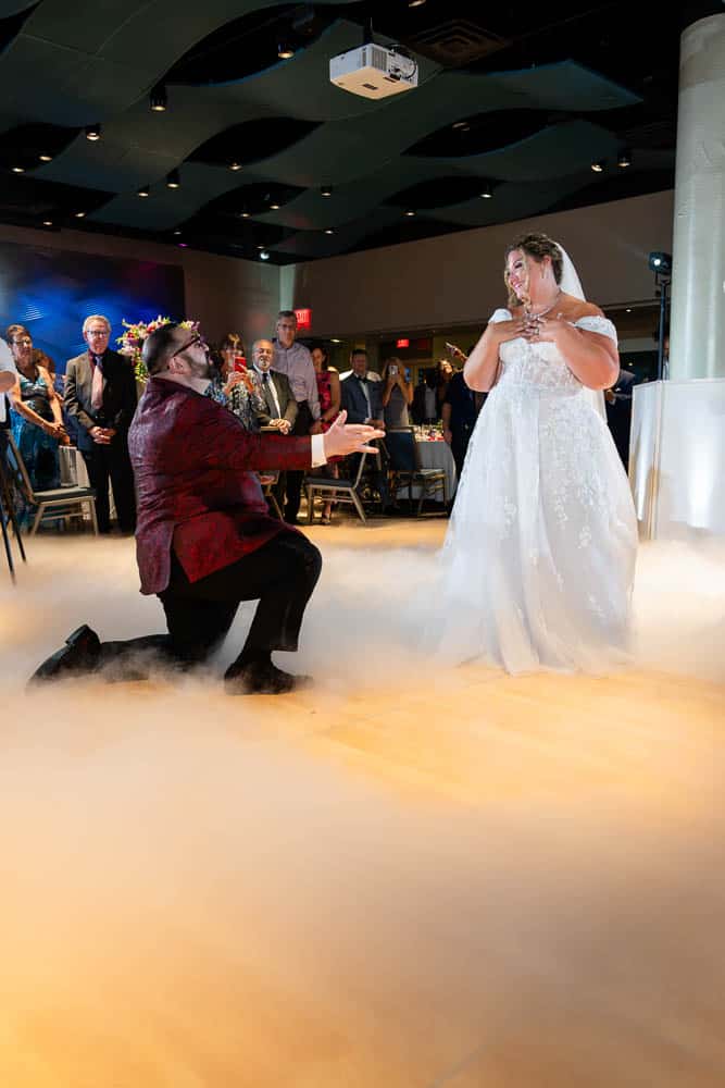 Bride and Groom enjoying their first dance at the Adventure Aquarium wedding reception.