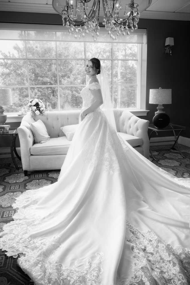 Full length black and white portrait of the bride at Bradford Estate.