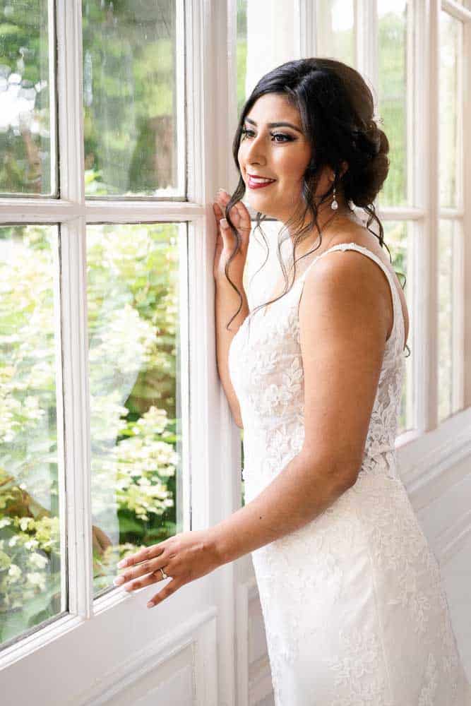 Closeup Photo of the bride looking out the window at the Collingswood Grand Ballroom Wedding.