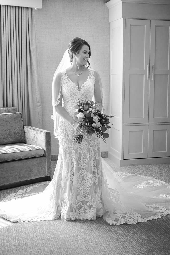 Black and white portrait of bride in her full length wedding gown at the ICONA Diamond Beach Wedding.