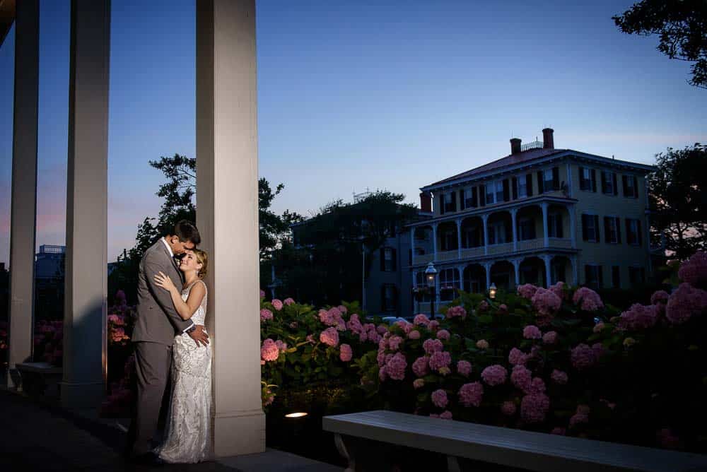 After sunset photo with bride and groom outside Congress Hall wedding venue in Cape May NJ