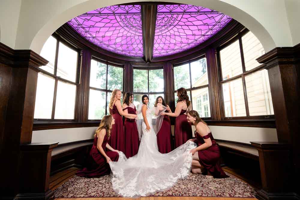 Bridesmaids fussing over the bride at the Collingswood Grand Ballroom Wedding.