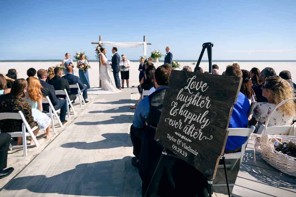 Bride and groom prepare to exchange vows at the ICONA Diamond Beach Wedding.