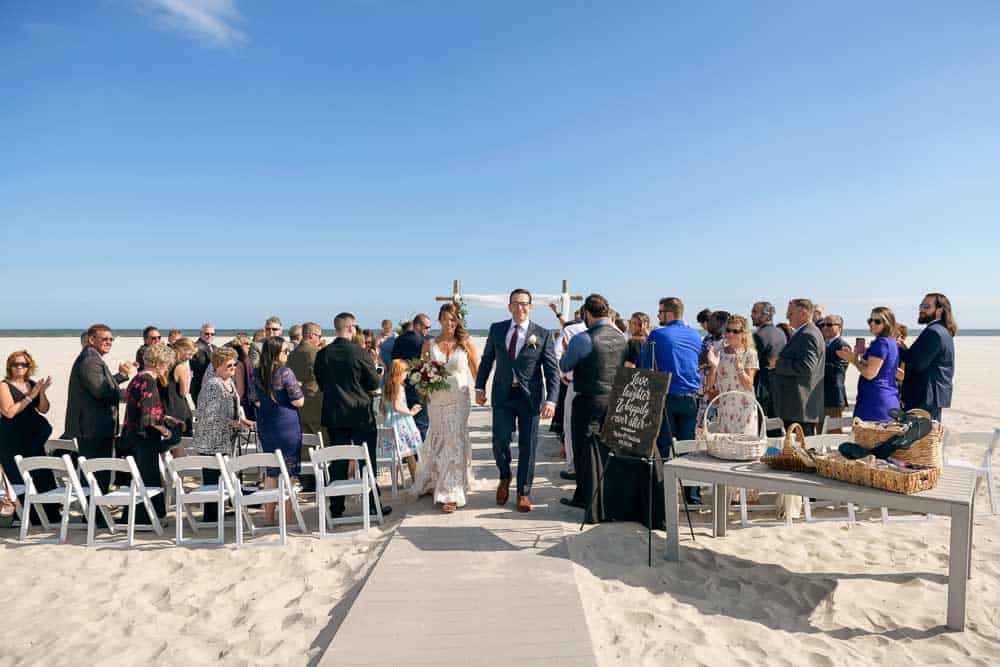 bride and groom at the conclusion of the wedding ceremony at the ICONA Diamond Beach.