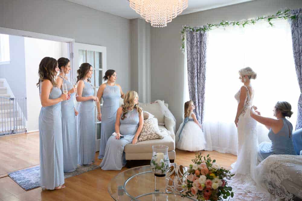 Bride and bridesmaids during bridal preparation at Luciens Manor in Berlin NJ