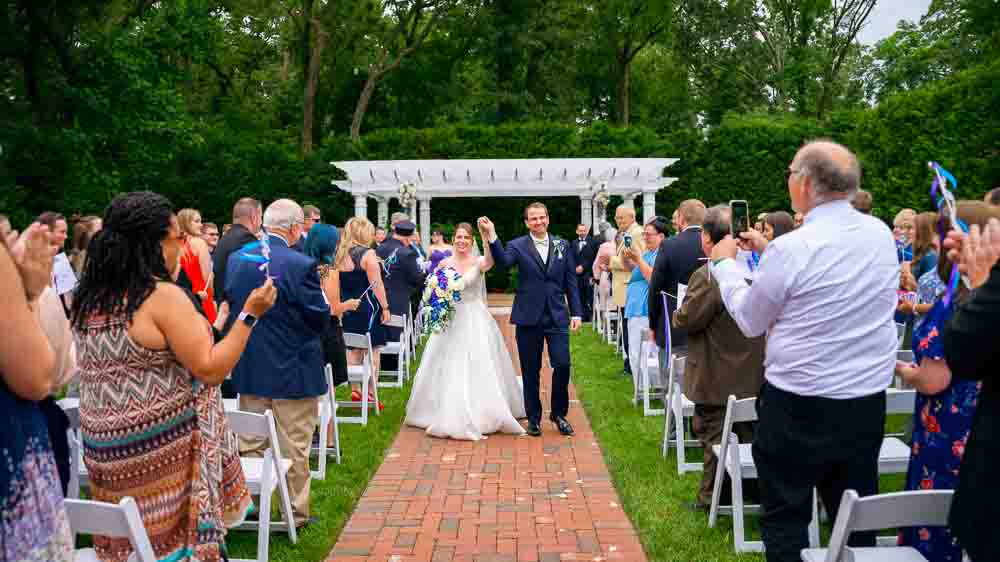 Bride and groom congratulated by guest after the ceremony at Bradford Estate.