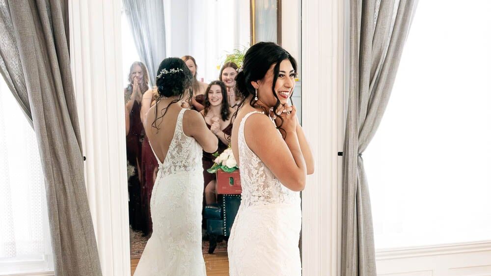 Closeup Photo of the Bridesmaids looking at Alana the bride at the Collingswood Grand Ballroom Wedding.