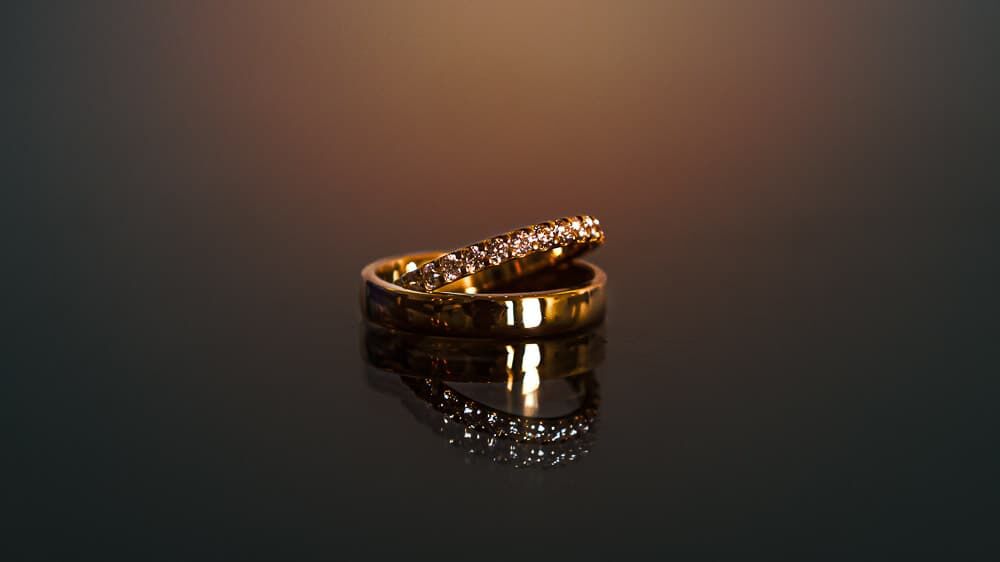 Detail photo of the groom and brides wedding rings at the ICONA Diamond Beach Wedding.