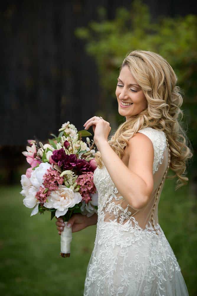 Bride glancing at her wedding ring outside the Cape May winery