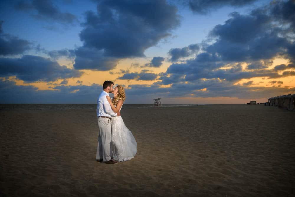 Cape May beach sunset with bride and groom