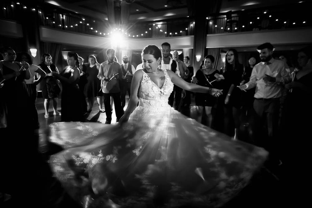 Bride dancing and twriling her dress at Collingwood Grand Ballroom.